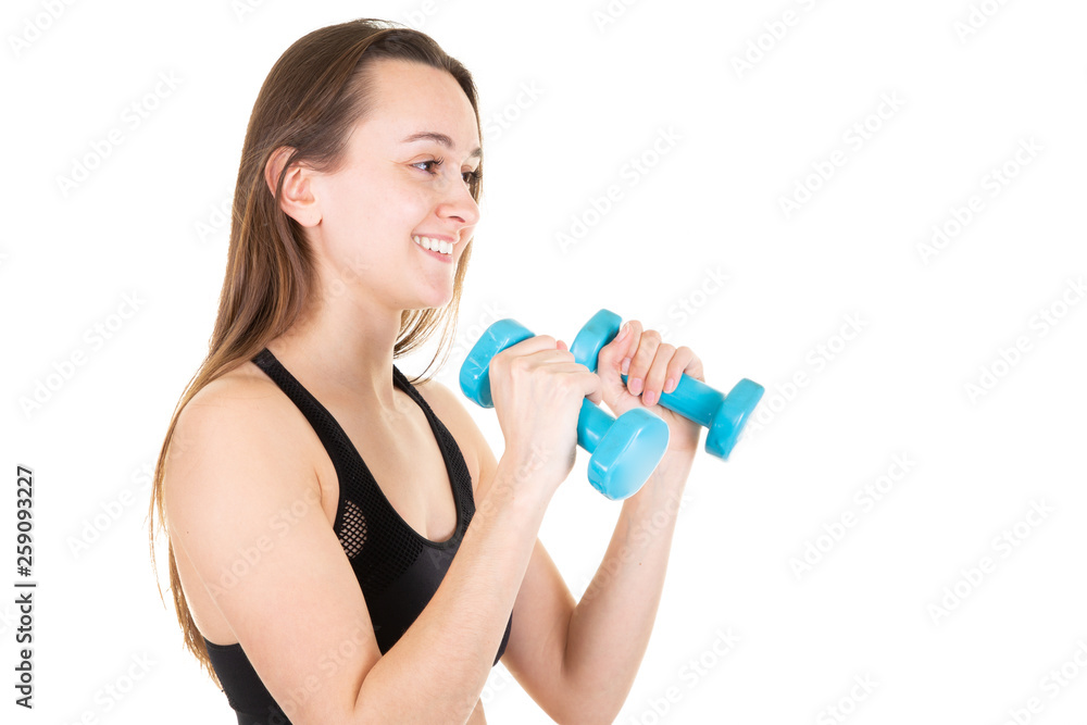 Woman young and slim fit workout with blue dumbbells isolated Woman young and slim fit workout with blue dumbbells isolated
