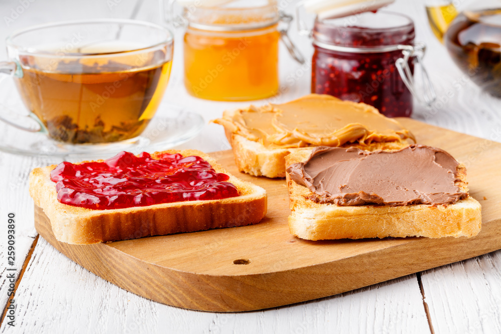 Delicious toast with sweet jam served for breakfast on table Delicious toast with sweet jam served for breakfast on table