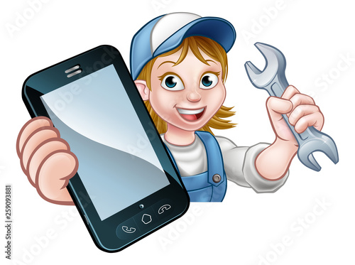 A plumber, mechanic or handyman holding a spanner and phone with copyspace