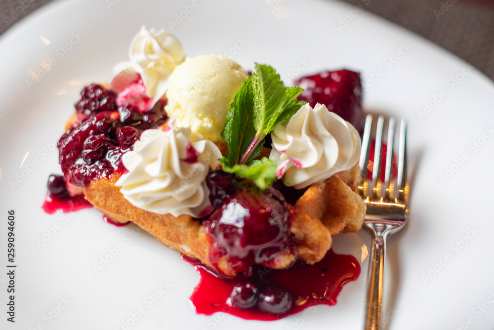 Belgian waffles with ice cream and berries Belgian waffles with ice cream and berries