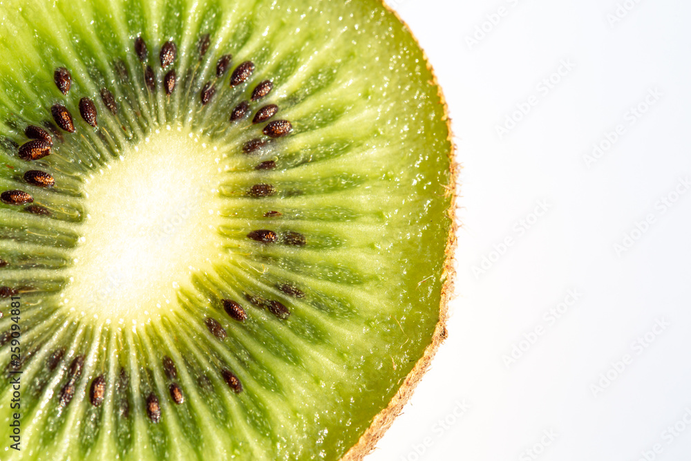 Kiwi fruit slice in closeup or macro isolate on white background and texture Kiwi fruit slice in closeup or macro isolate on white background and texture