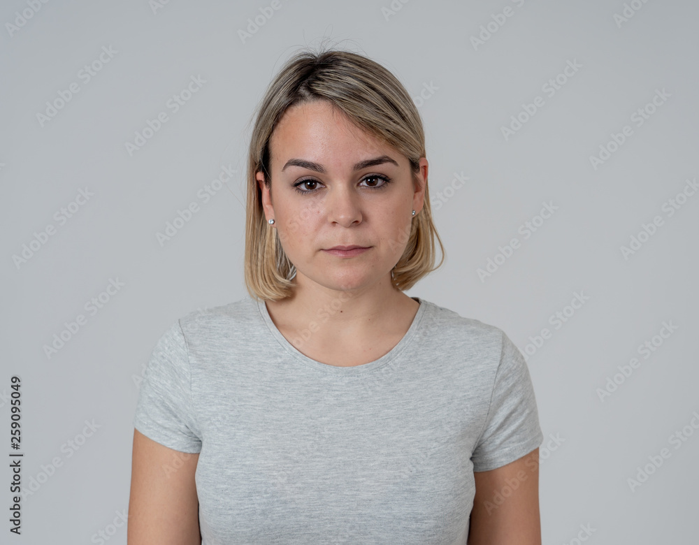 Portrait of a beautiful young woman with angry face looking furious. Human expressions and emotions Portrait of a beautiful young woman with angry face looking furious. Human expressions and emotions