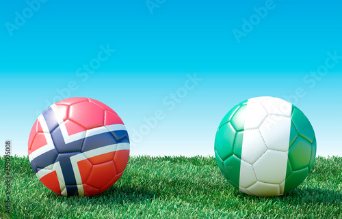 Two soccer balls in flags colors on green grass. Norway and Nigeria. 3d image