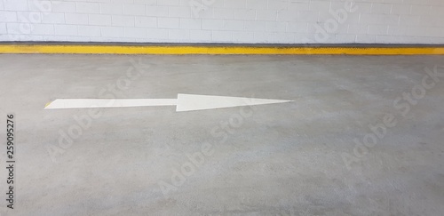 Road arrow pointing to right on concrete road