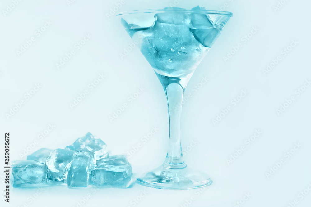 drink in a martini glass with ice cubes. drink in a martini glass with ice cubes.