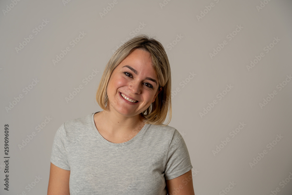 Portrait of young attractive cheerful woman with smiling happy face. Human expressions and emotions Portrait of young attractive cheerful woman with smiling happy face. Human expressions and emotions