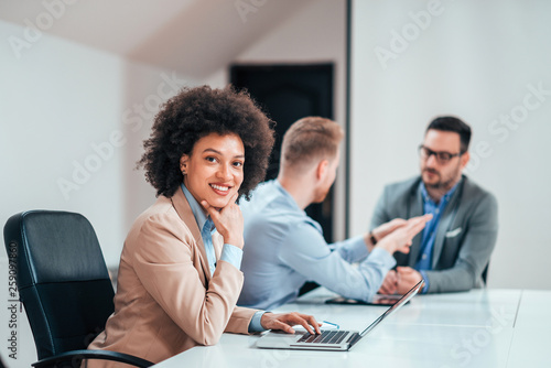 Portrait of attractive young entrepreneur in bright office.