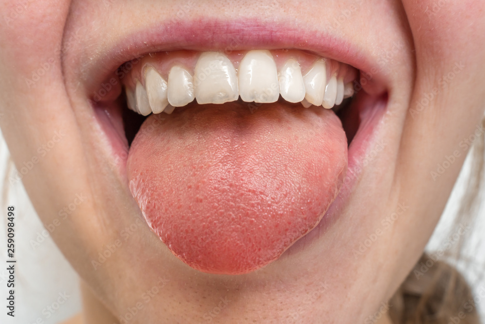 Obraz premium Woman with open mouth showing tongue