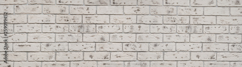 Old white wash brick wall texture. Wide panorama of masonry