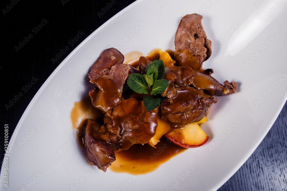 Duck liver with berry sauce and apples decorated with rosemary Duck liver with berry sauce and apples decorated with rosemary