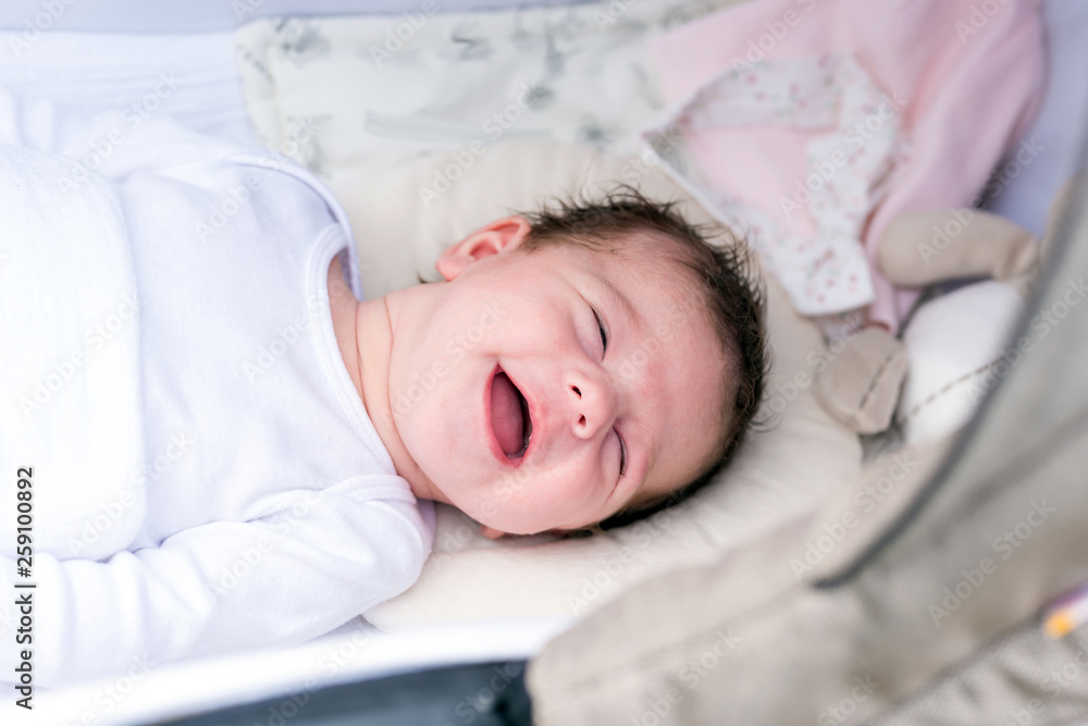 Portrait of a baby girl lying in a stroller Portrait of a baby girl lying in a stroller