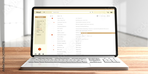 Canvas Print Email list on a computer laptop screen, wooden office desk, empty room background