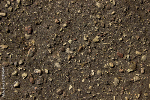 Small stones on black ground. Texture