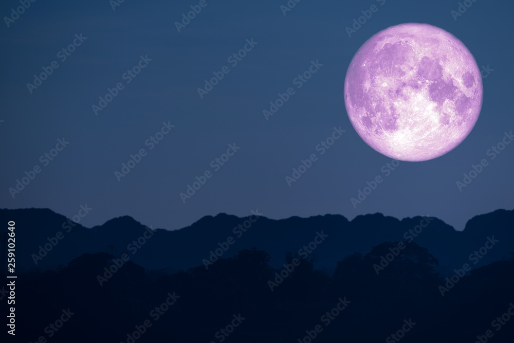 super flower pink moon back on silhouette mountain on night sky