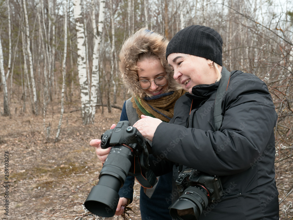 Fototapeta premium photographer and model in nature in spring.