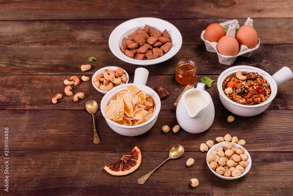 Tasty and useful breakfast with flakes, milk, nuts and dried fruits. The healthy food loading with energy Tasty and useful breakfast with flakes, milk, nuts and dried fruits. The healthy food loading with energy