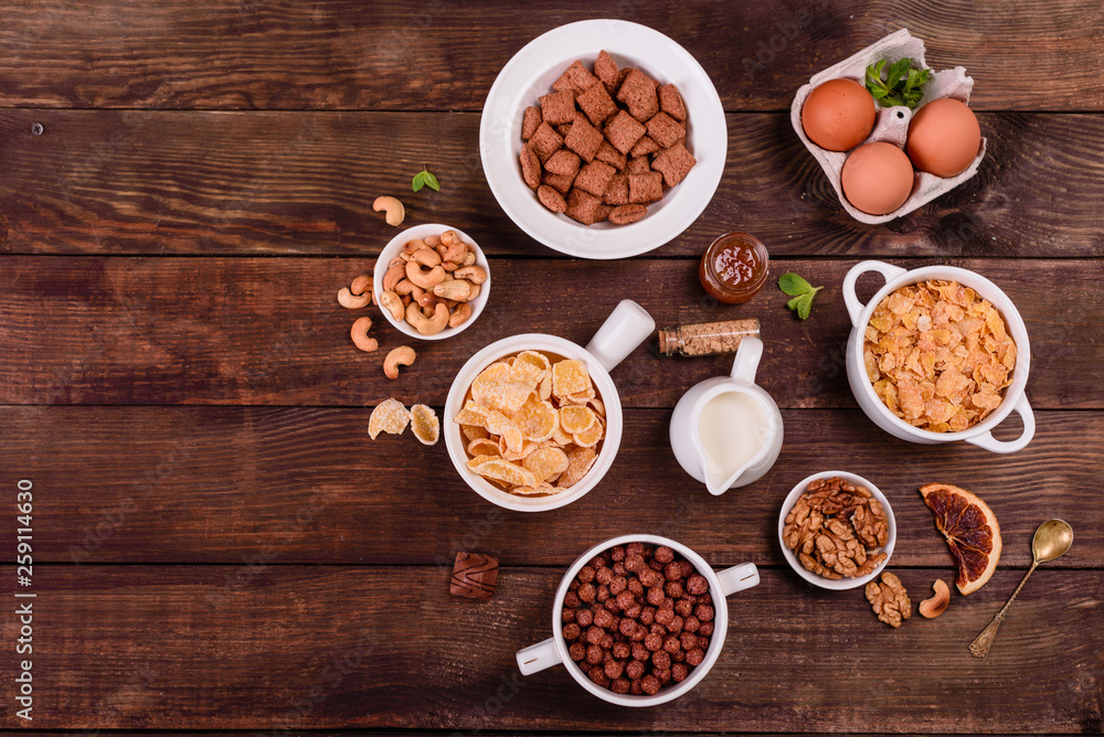 Tasty and useful breakfast with flakes, milk, nuts and dried fruits. The healthy food loading with energy Tasty and useful breakfast with flakes, milk, nuts and dried fruits. The healthy food loading with energy