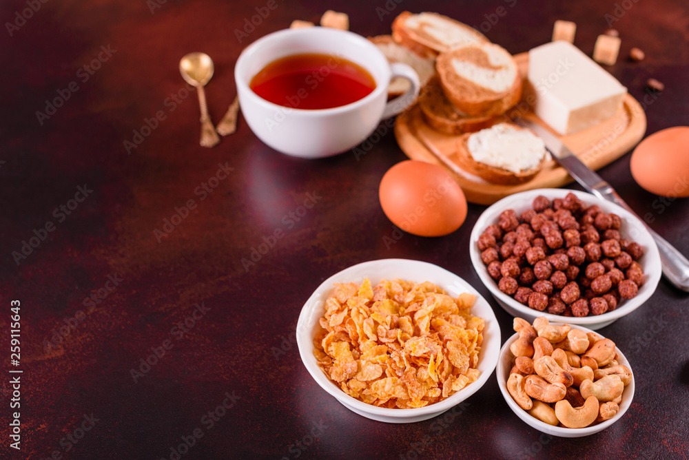 Tasty and useful breakfast with flakes, milk, nuts and dried fruits. The healthy food loading with energy Tasty and useful breakfast with flakes, milk, nuts and dried fruits. The healthy food loading with energy