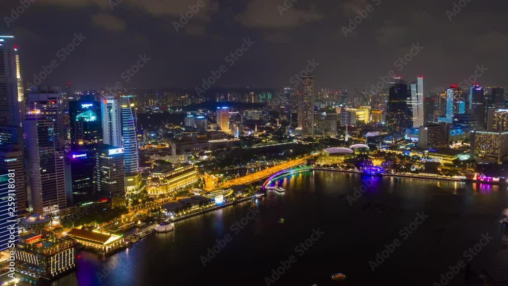 night time illuminated singapore city flight over famous hotel bay aerial panorama 4k timelapse night time illuminated singapore city flight over famous hotel bay aerial panorama 4k timelapse