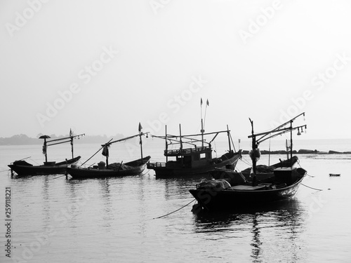 black and white fishing boat in Thailand