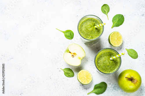 Green smoothie from fruit and vegetable on white.