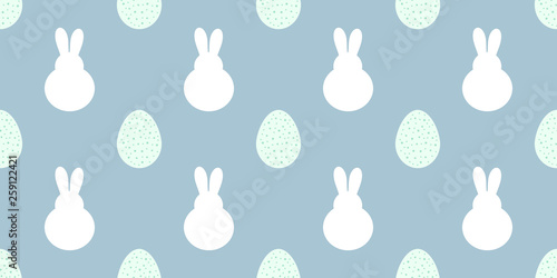 Easter bunnies and eggs samless blue pattern.