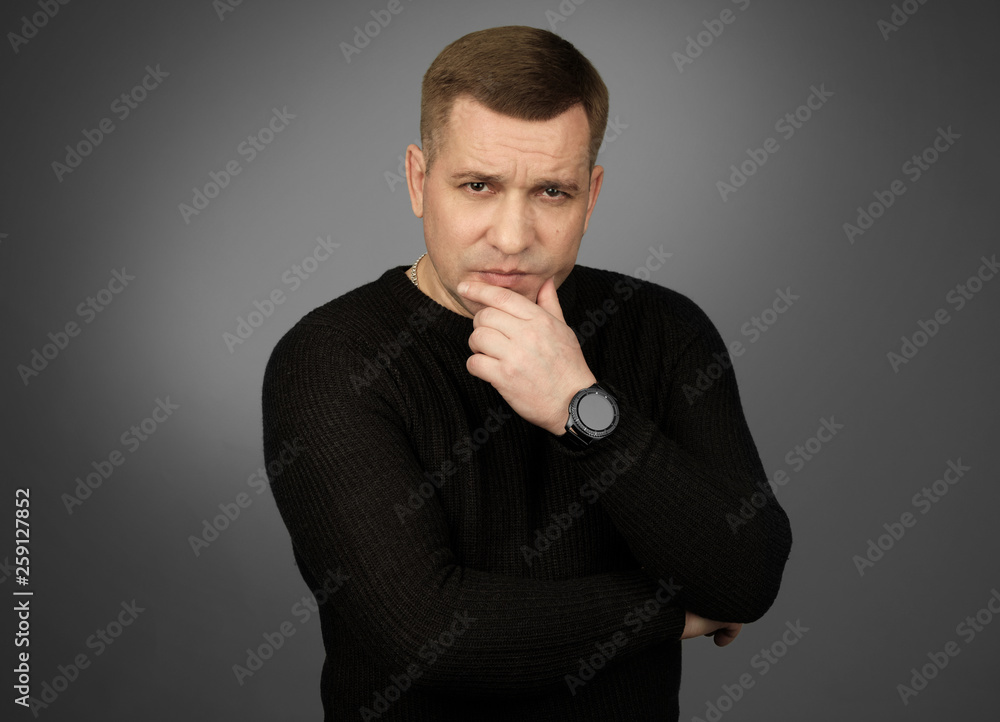 Portrait of a thoughtful guy in black sweater Portrait of a thoughtful guy in black sweater
