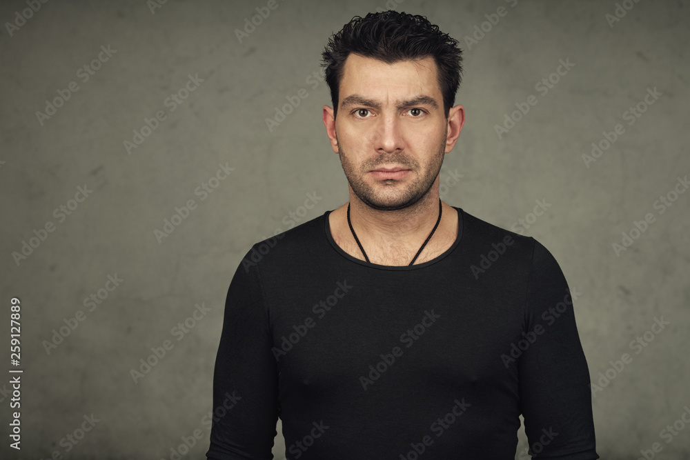 Portrait of handsome bearded man in black t-shirt