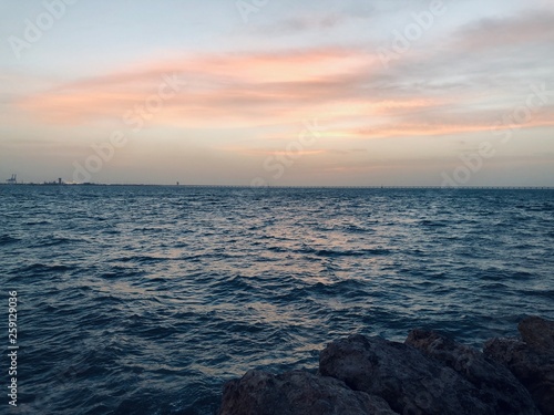 Fototapeta Naklejka Na Ścianę i Meble -  The sky of Kuwait on the sea at sunset. Photographed in : 1/4/2019
