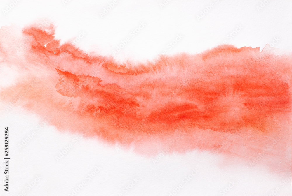 Trend photo on the theme of fashionable orange hue this season. Bright blurred smear of watercolor paint on a white paper background.