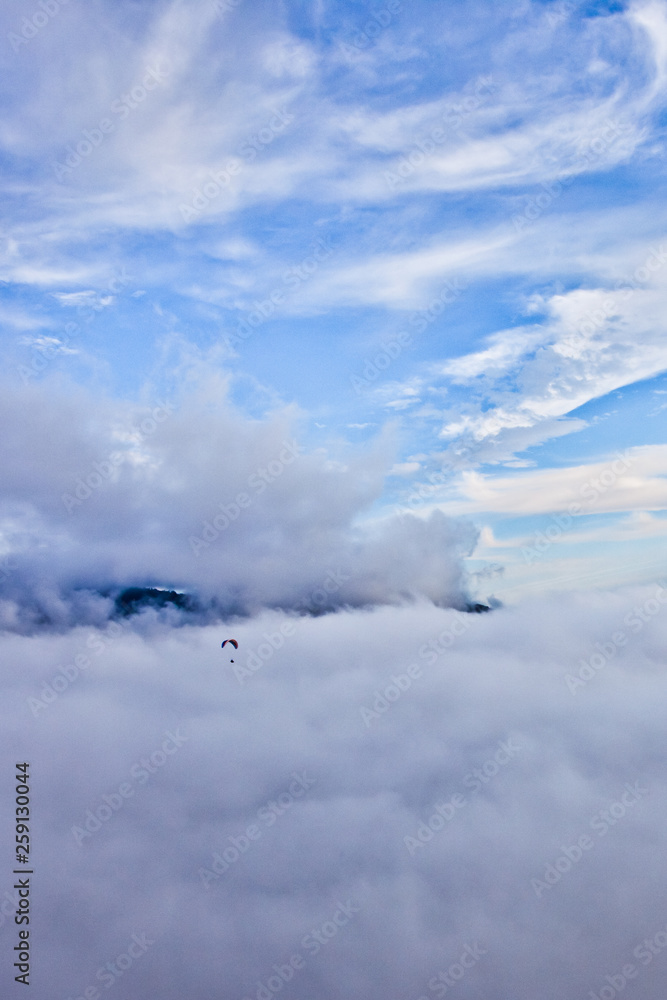 Little pilot glider. Flying above the clouds (sea of clouds) foggy view from a great height Aerial view from a height in in Abkhazia Little pilot glider. Flying above the clouds (sea of clouds) foggy view from a great height Aerial view from a height in in Abkhazia