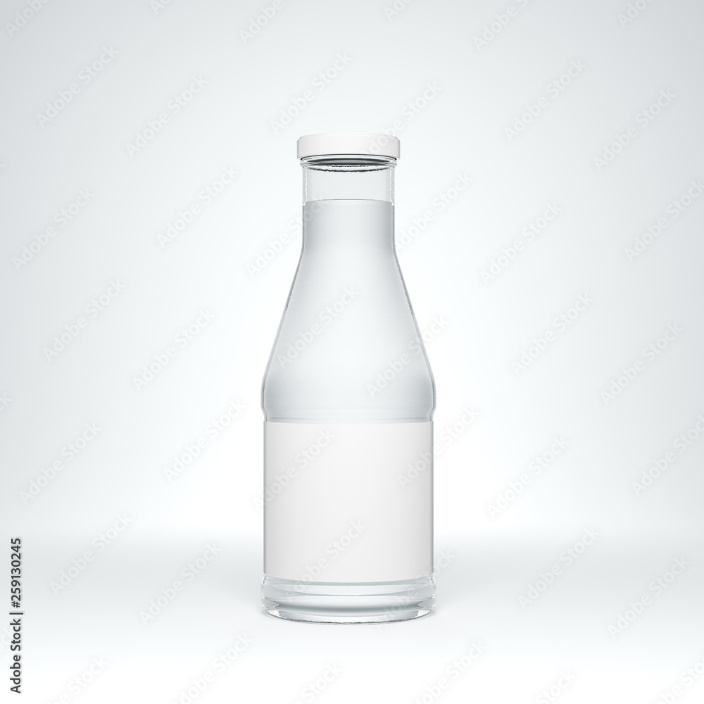 Transparent glass bottle with metal cap and label filled by still water on the white background. Transparent glass bottle with metal cap and label filled by still water on the white background.