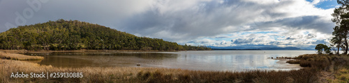 Panoramic view of a sheltered cove and hills on the coast of Bruny Island in Tasmania  Australia