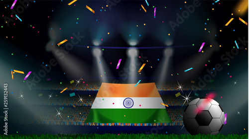 Fans hold the flag of India among silhouette of crowd audience in soccer stadium with confetti to celebrate football game. Concept design for football result template