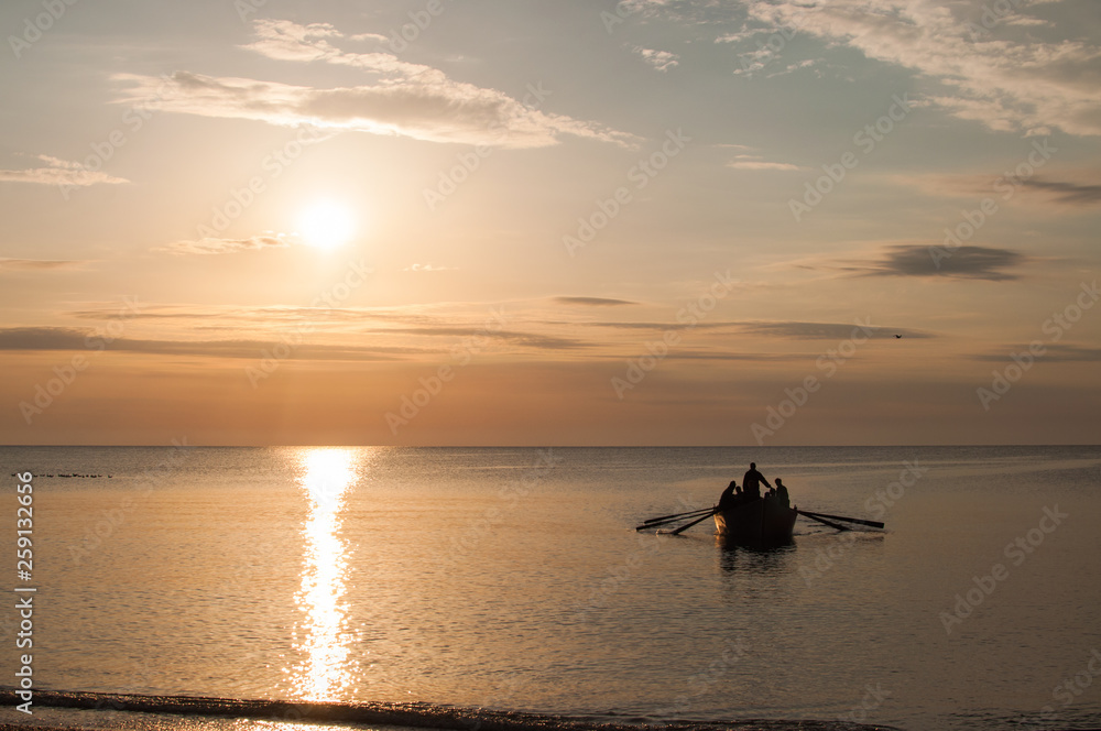 Fishermen rowing at sunrise Black Sea Fishermen rowing at sunrise Black Sea