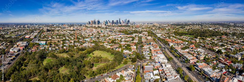 Aerial view of the suburbs of Clifton Hill and Fitzroy, with the city of Melbourne in the background