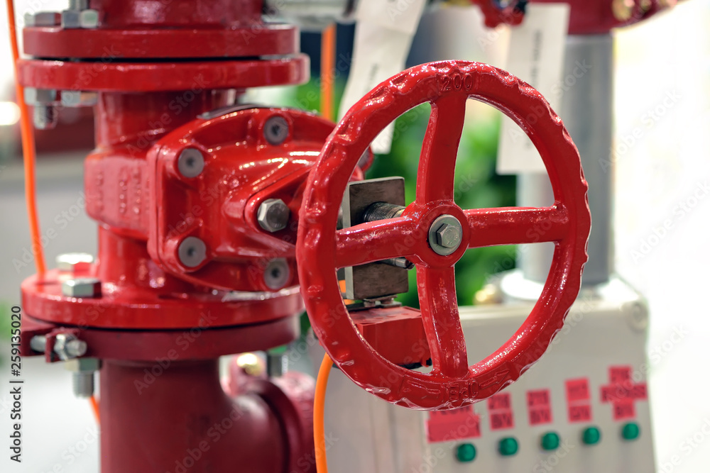 Red industrial valve on pipelines system Red industrial valve on pipelines system