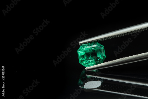 Emerald Gemstone in Tweezers