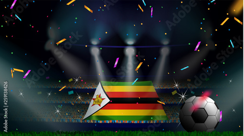 Fans hold the flag of Zimbabwe among silhouette of crowd audience in soccer stadium with confetti to celebrate football game. Concept design for football result template