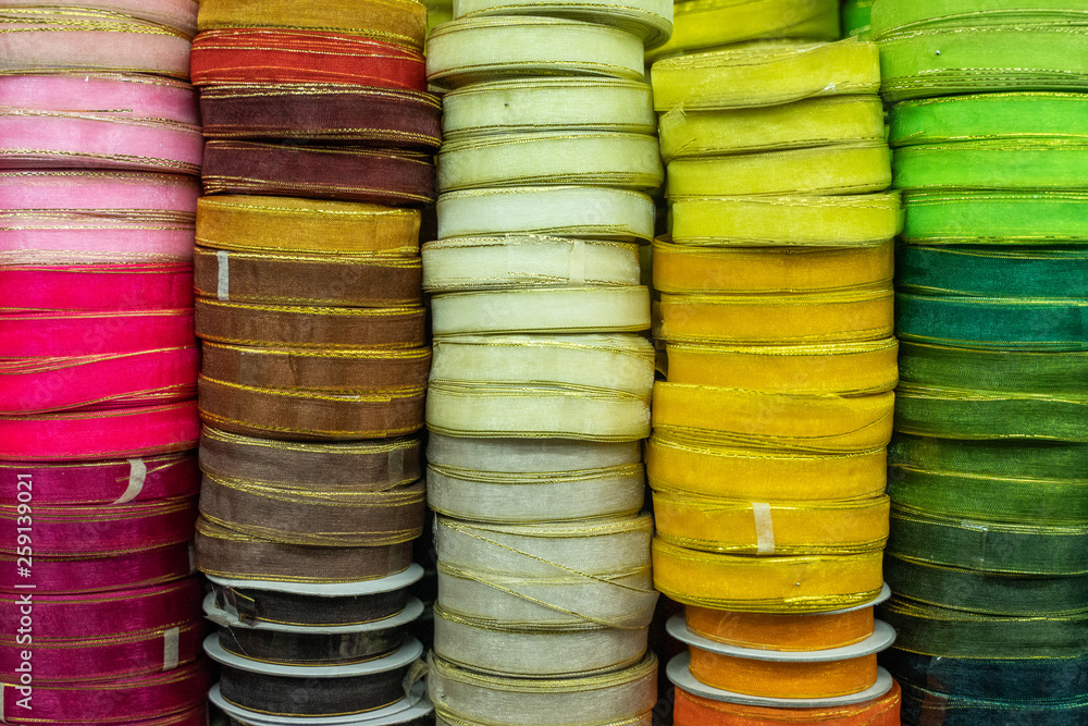 close up of stack of colorful ribbon on shelves close up of stack of colorful ribbon on shelves