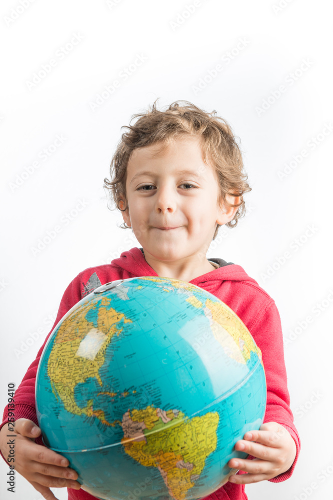 Child holding a globe in his arms. Child holding a globe in his arms.