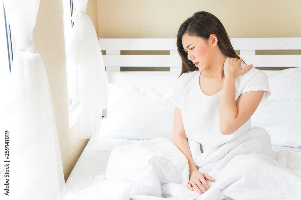 Asian woman have neckache in bedroom morning because sleep problem Asian woman have neckache in bedroom morning because sleep problem