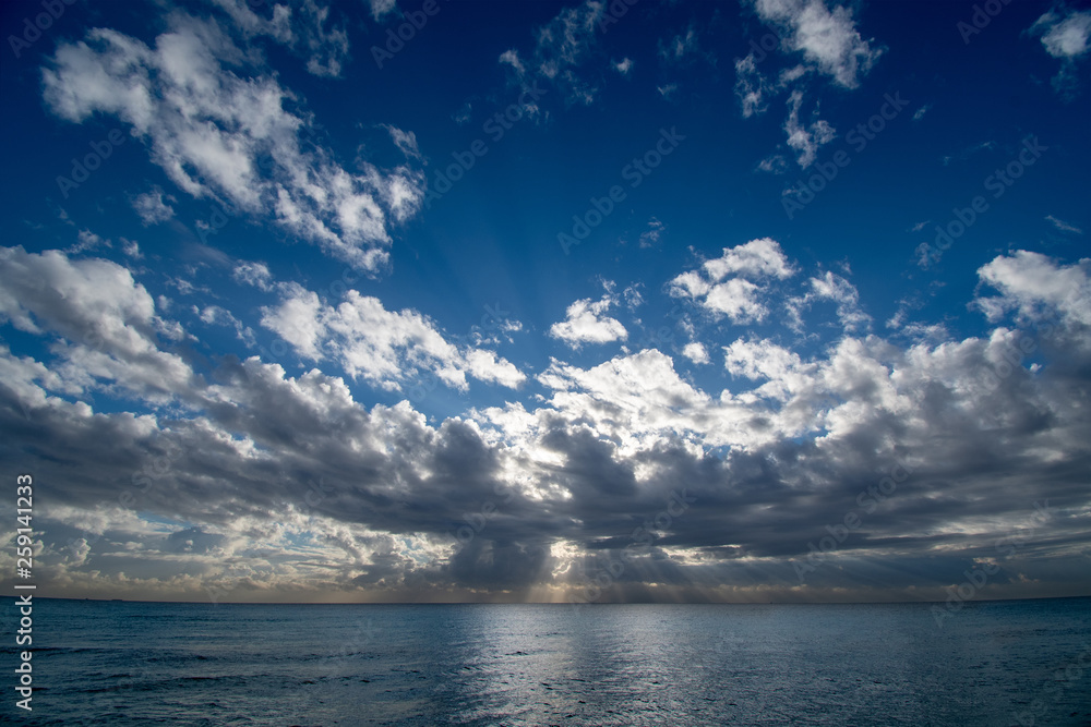 Sunrise over the ocean in Miami Beach with a cloudy sky