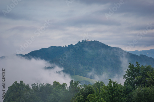 Foggy morning on the Smarjetna Gora, Kranj, Slovenia photo