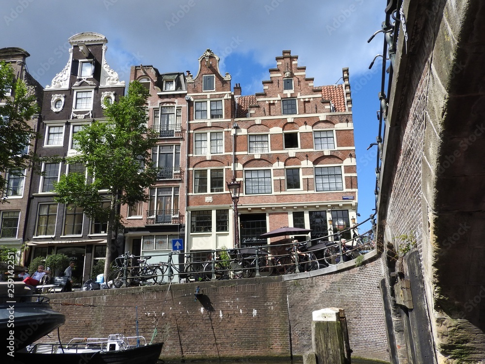 Canal in Amsterdam Netherlands houses the Amstel river landmark old European city summer landscape.