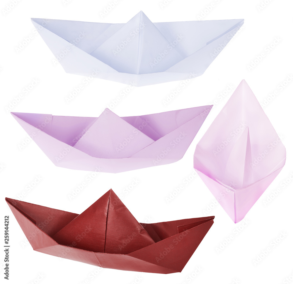 set of four origami boats on white set of four origami boats on white