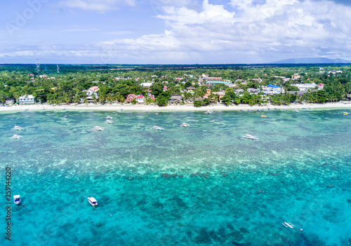 Aerial Drone Panorama Picture of the white sand Alona Beach in Panglao, Bohol in the Philippines
