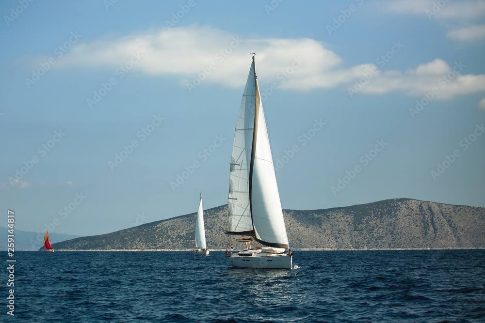 Sailing yacht boat at the Aegean Sea near Greece coasts. Luxury cruise yachting.