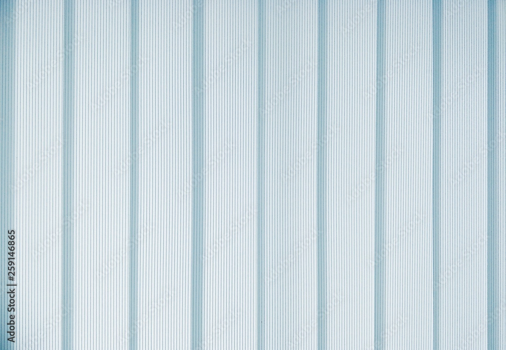 White and blue pattern of vertical translucent curtain background in living room on home interior decorations concept White and blue pattern of vertical translucent curtain background in living room on home interior decorations concept