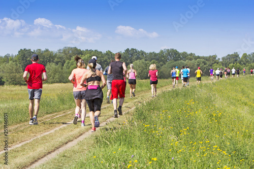 A lot of people on Marathon running in nature